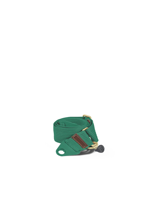 Green strap with a metal clip on a white background