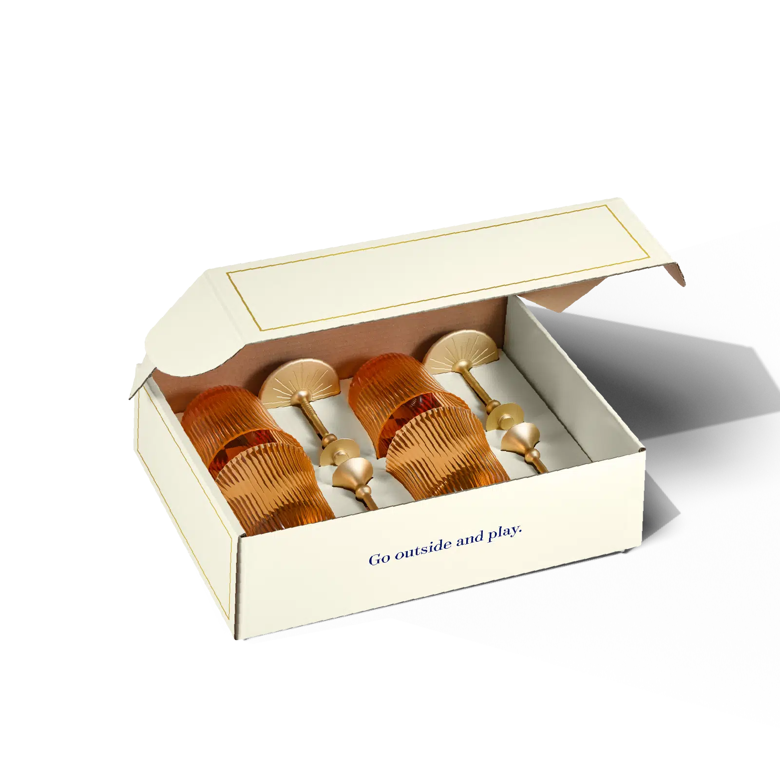 Set of gold hair accessories in a box with 'Go outside and play' text on a white background
